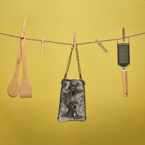 Small leather clutch bag in silver-black color