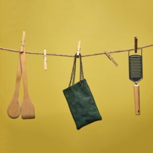 Women’s evening leather clutch bag in green color