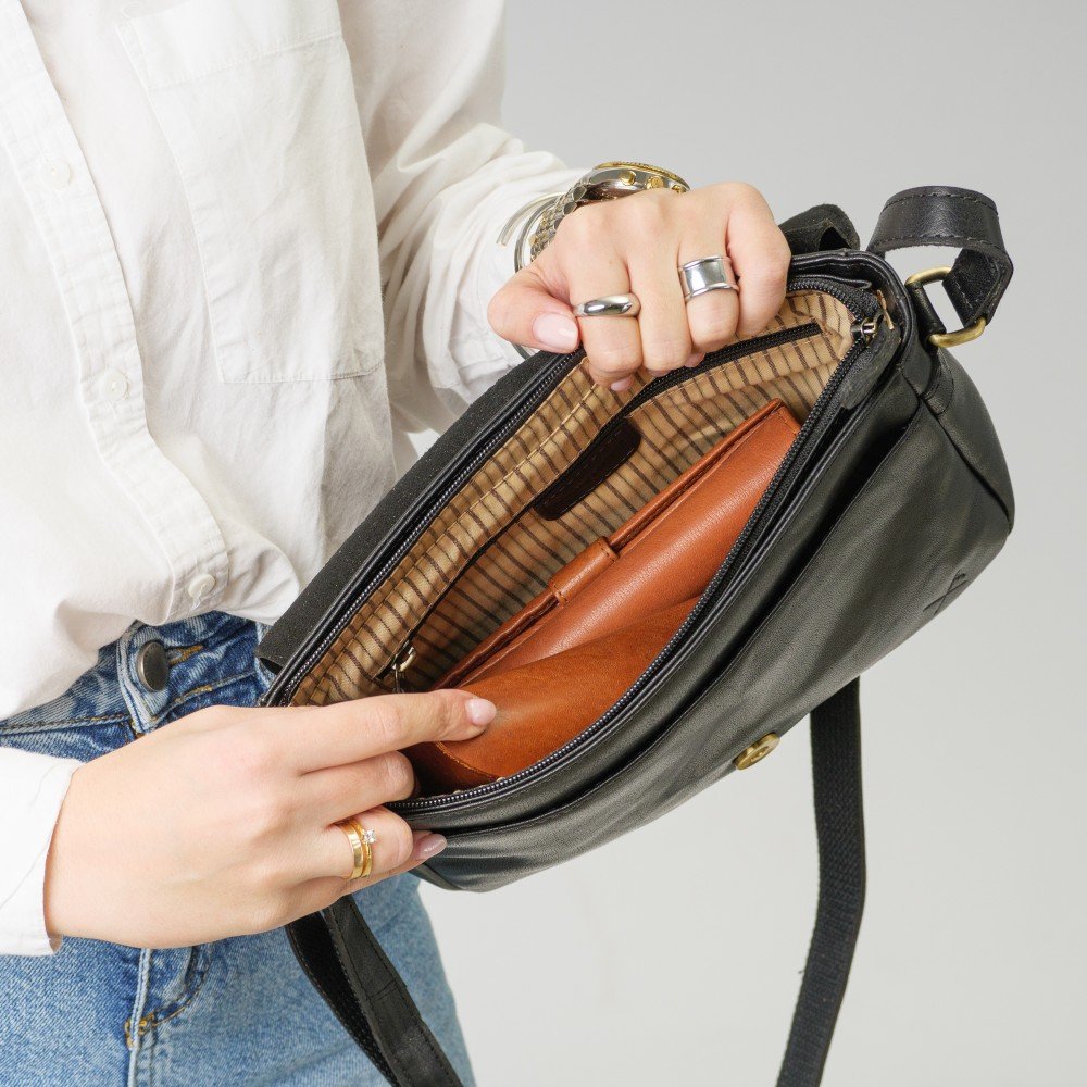 Large leather crossbody bag with a flap and zipper closure 2