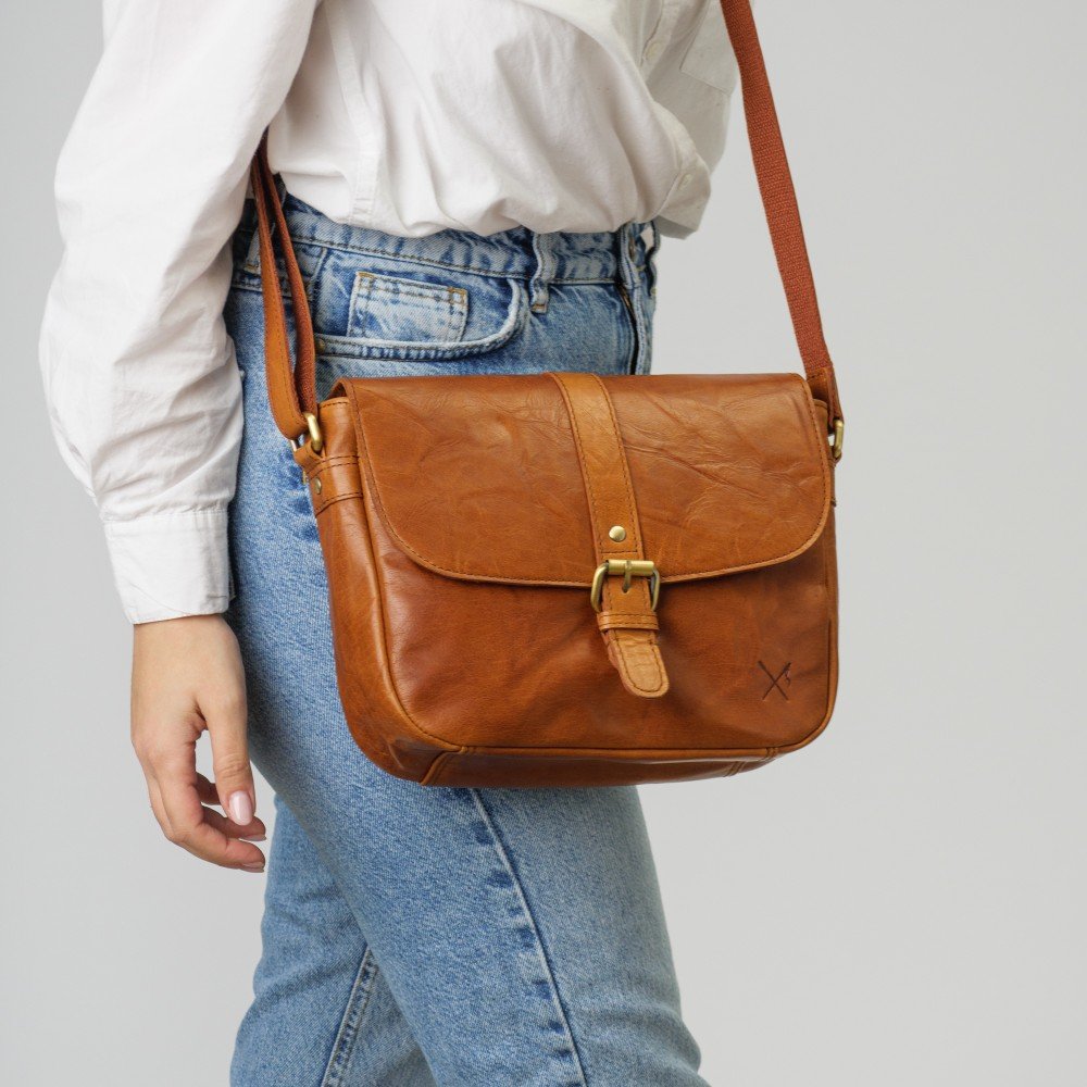 Large leather crossbody bag with a flap and zipper closure 1